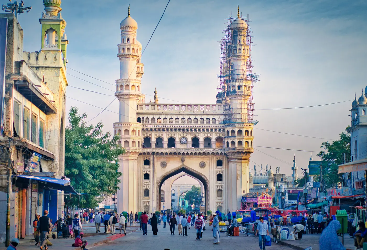 A busy street market beneath the Charminar monument in Hyderabad, India
